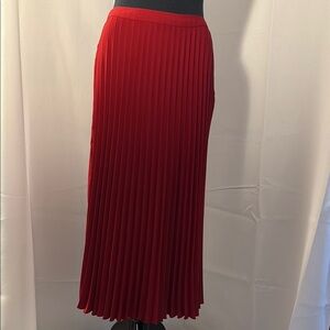 H&M Elegant Red Pleated Skirt with button and zipper closure.